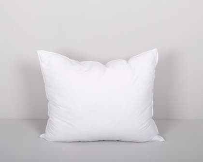 A white rectangular pillow against a light gray background.